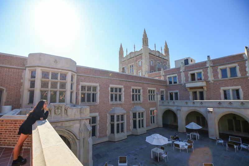 A UCLA student overlooking the Kerckhoff Hall patio
